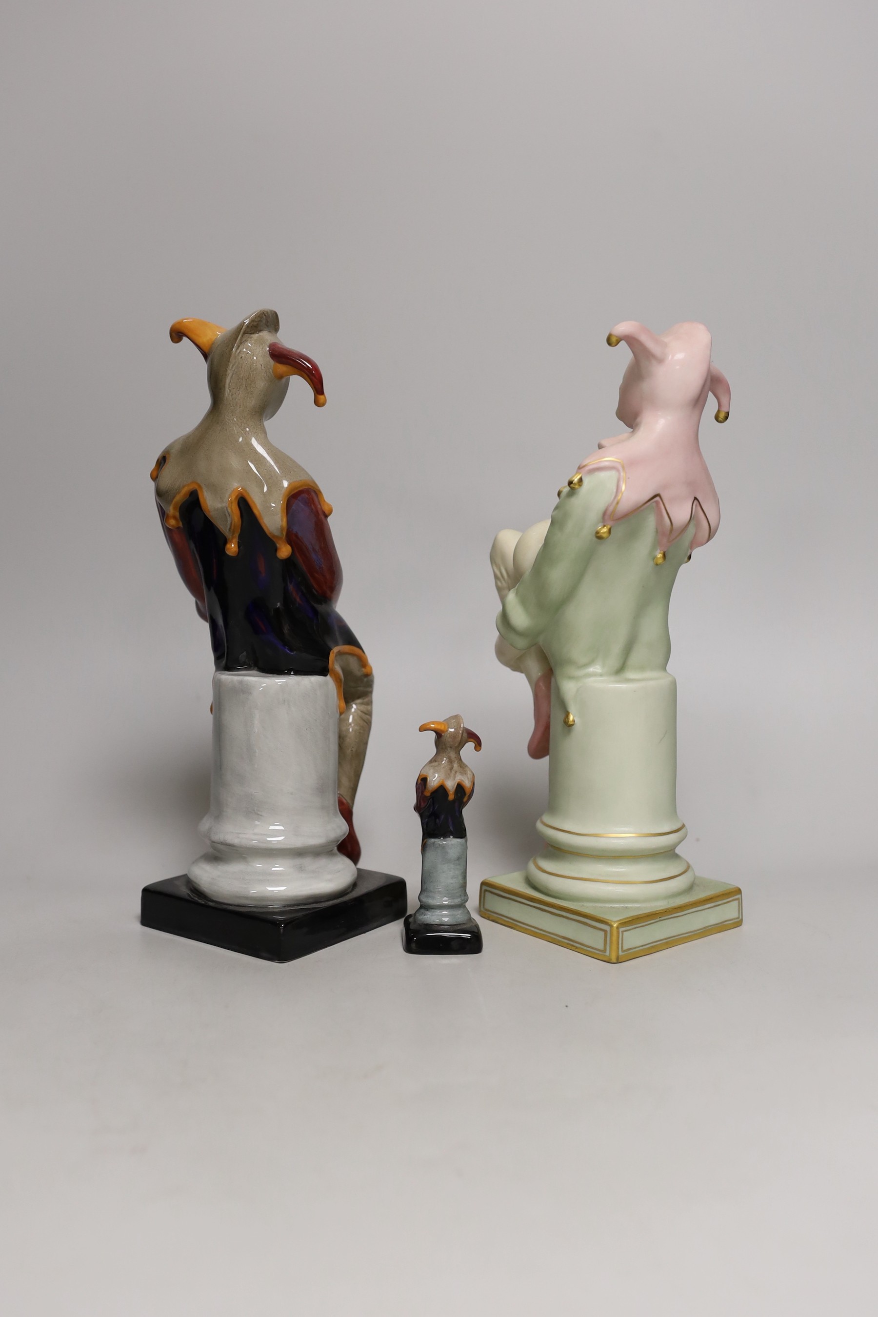 Three Royal Doulton figures, Jester, HN3922 150/950, HN2016 and HN3335 (miniature). Tallest 25cm